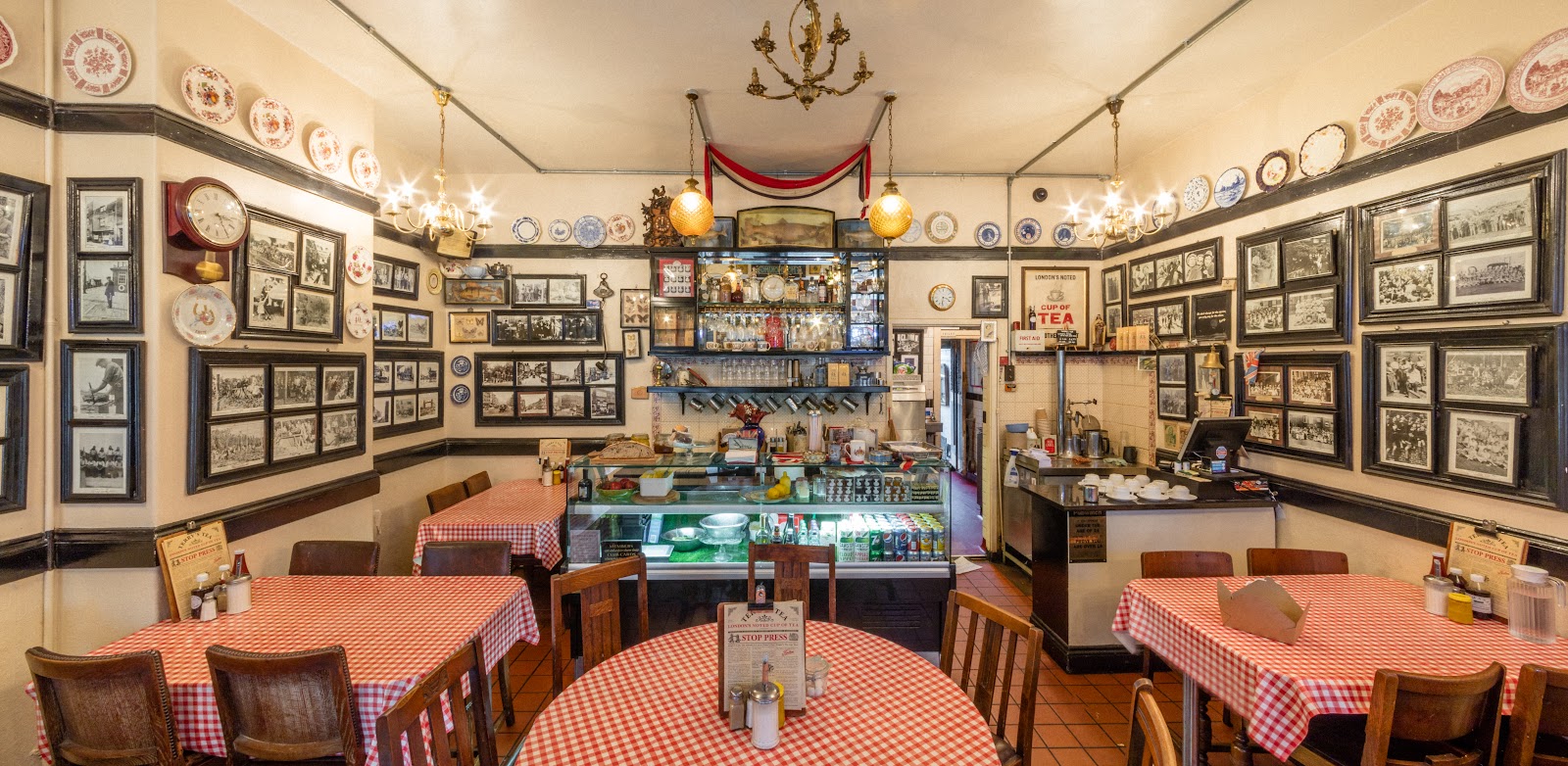 The characterful dining room at Terry's Cafe, walls full of vintage photos